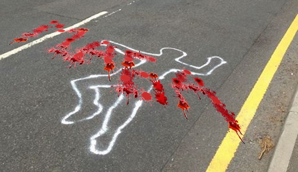 MAGA spelled out in blood over a chalk silhouette on the street.